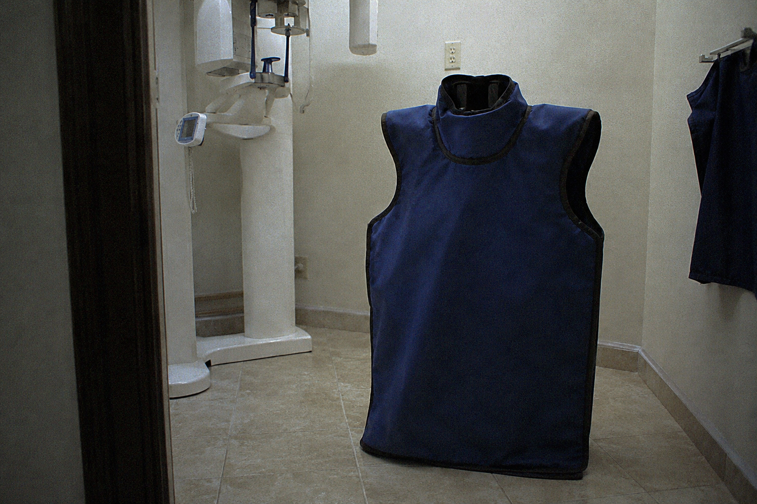 Lead apron beside dental X-ray machine