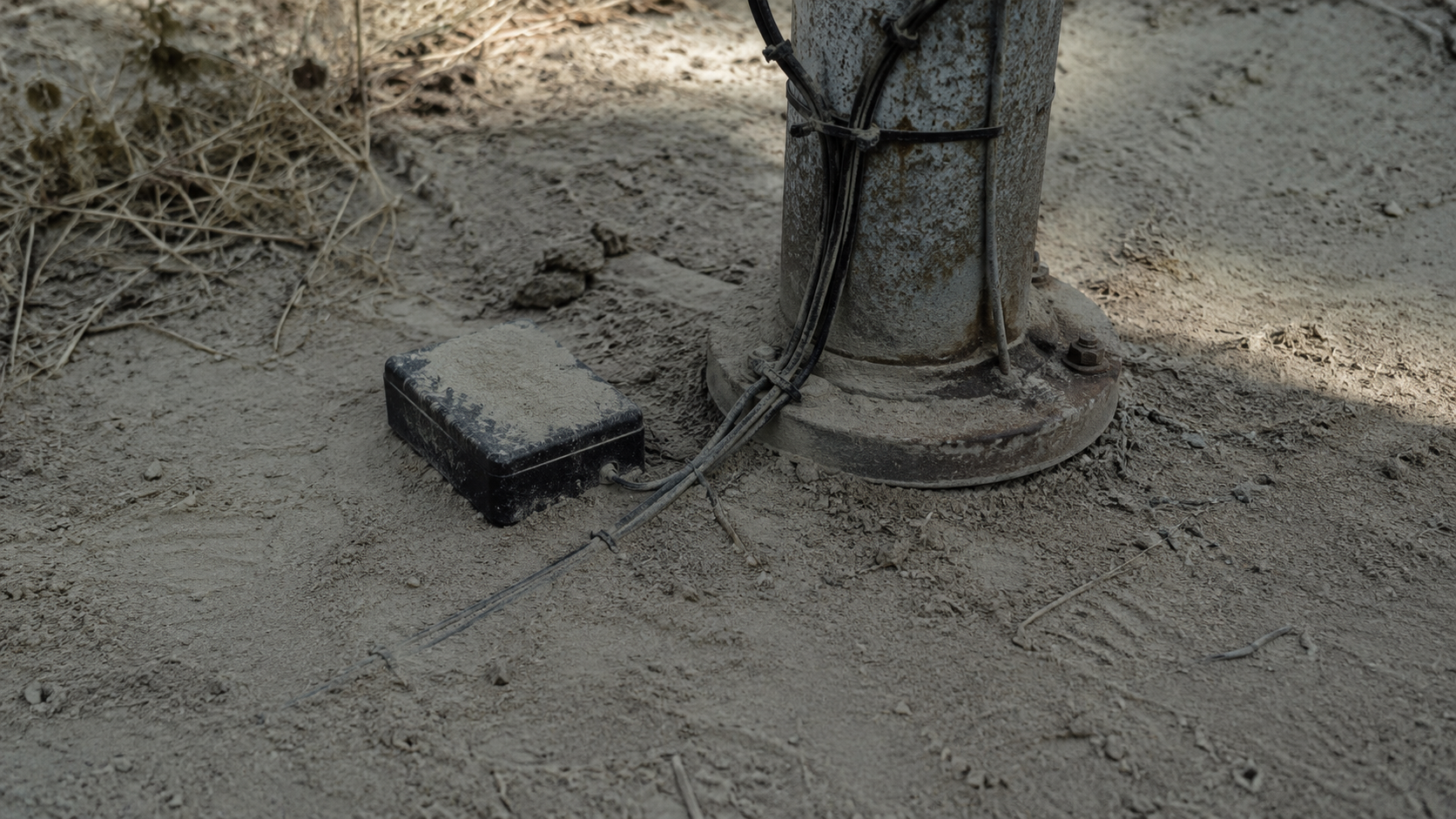 Undisturbed dust around radio pole base