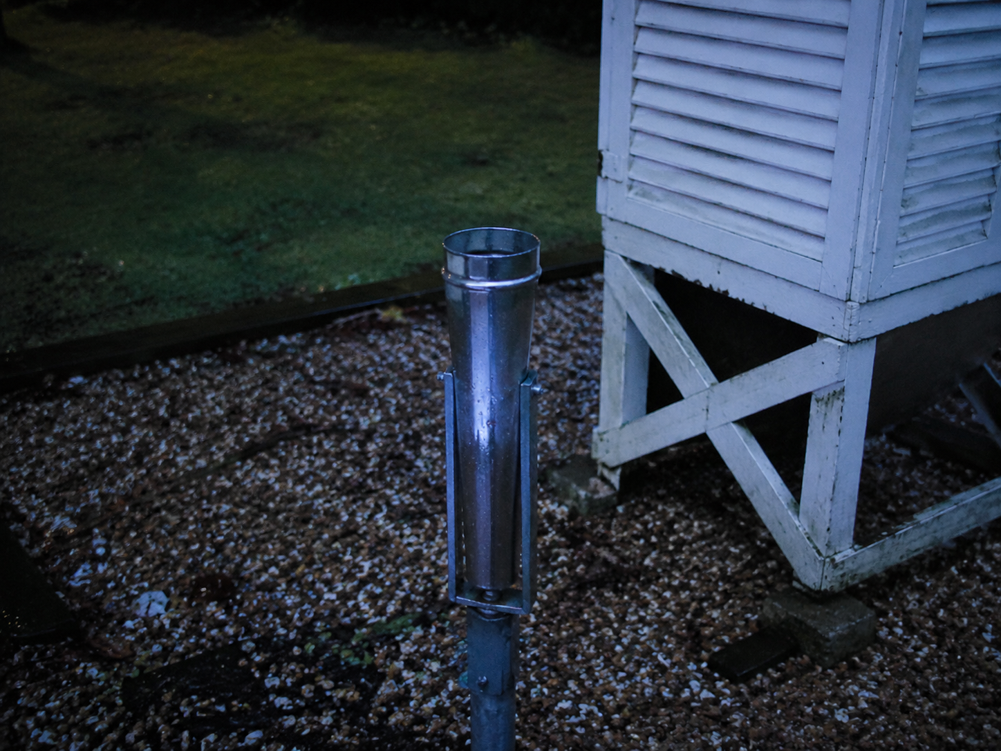 Blue flash near an empty rain gauge