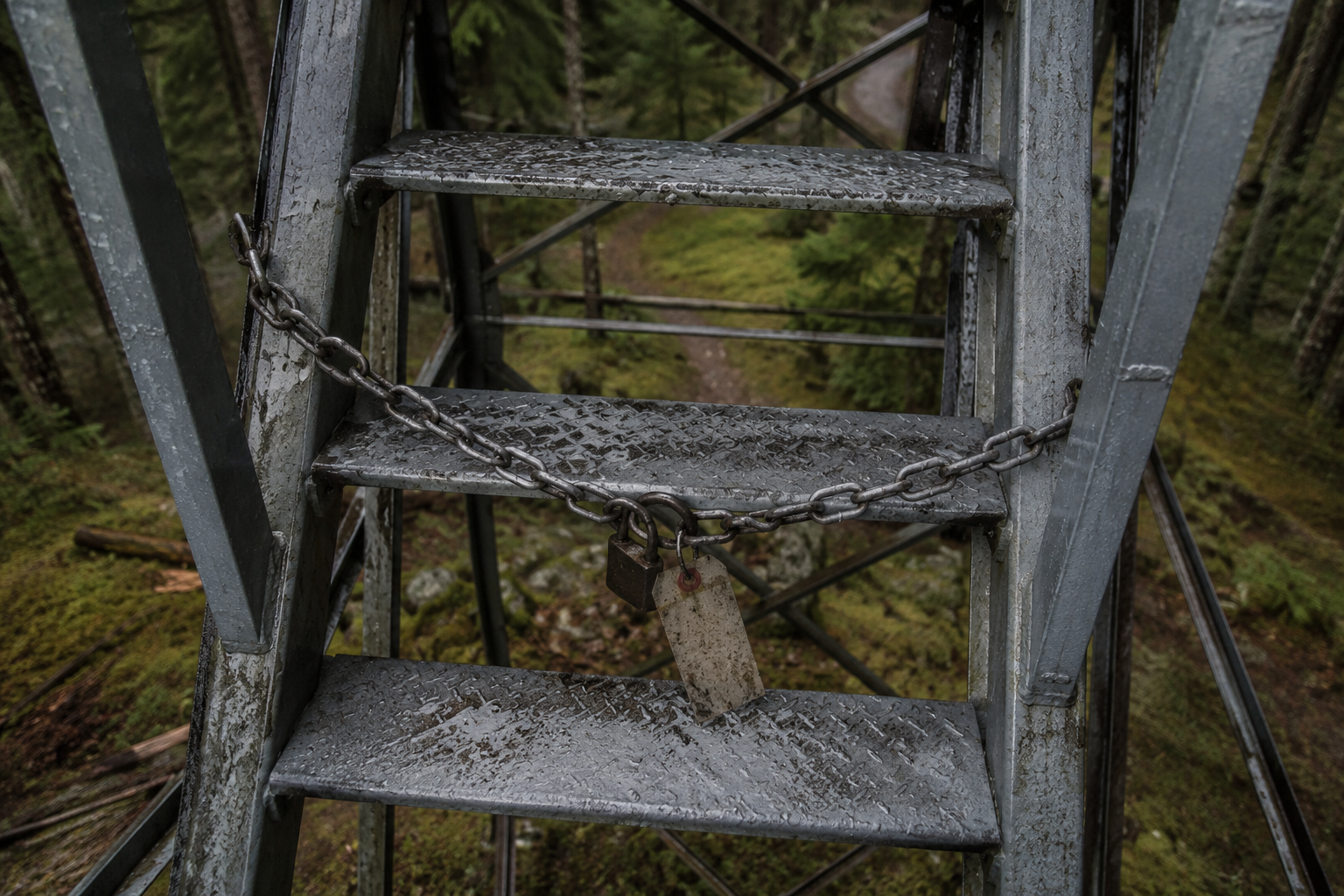 Locked chain across fire tower ladder