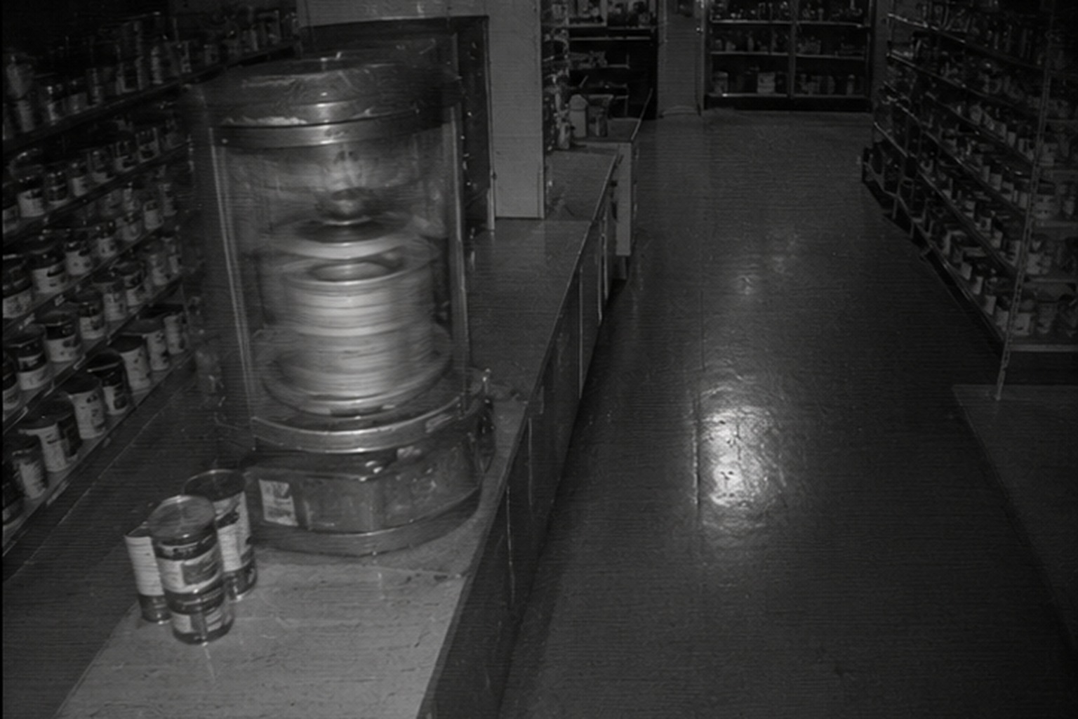 Paint mixer running by itself after midnight CAPTION 2: The old paint mixer started while the store was locked and the aisle appeared empty.