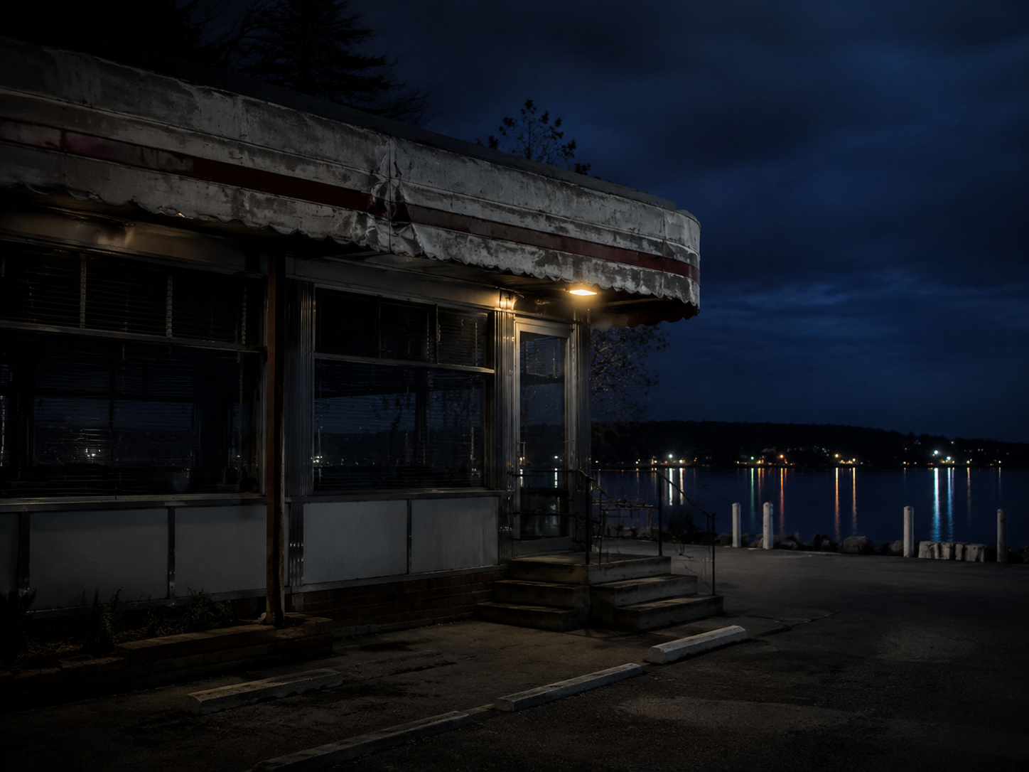 Closed lakeside diner after dark