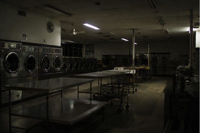 The laundromat was locked, the refund drawer was empty, and the back hallway camera watched the dryer row all night.