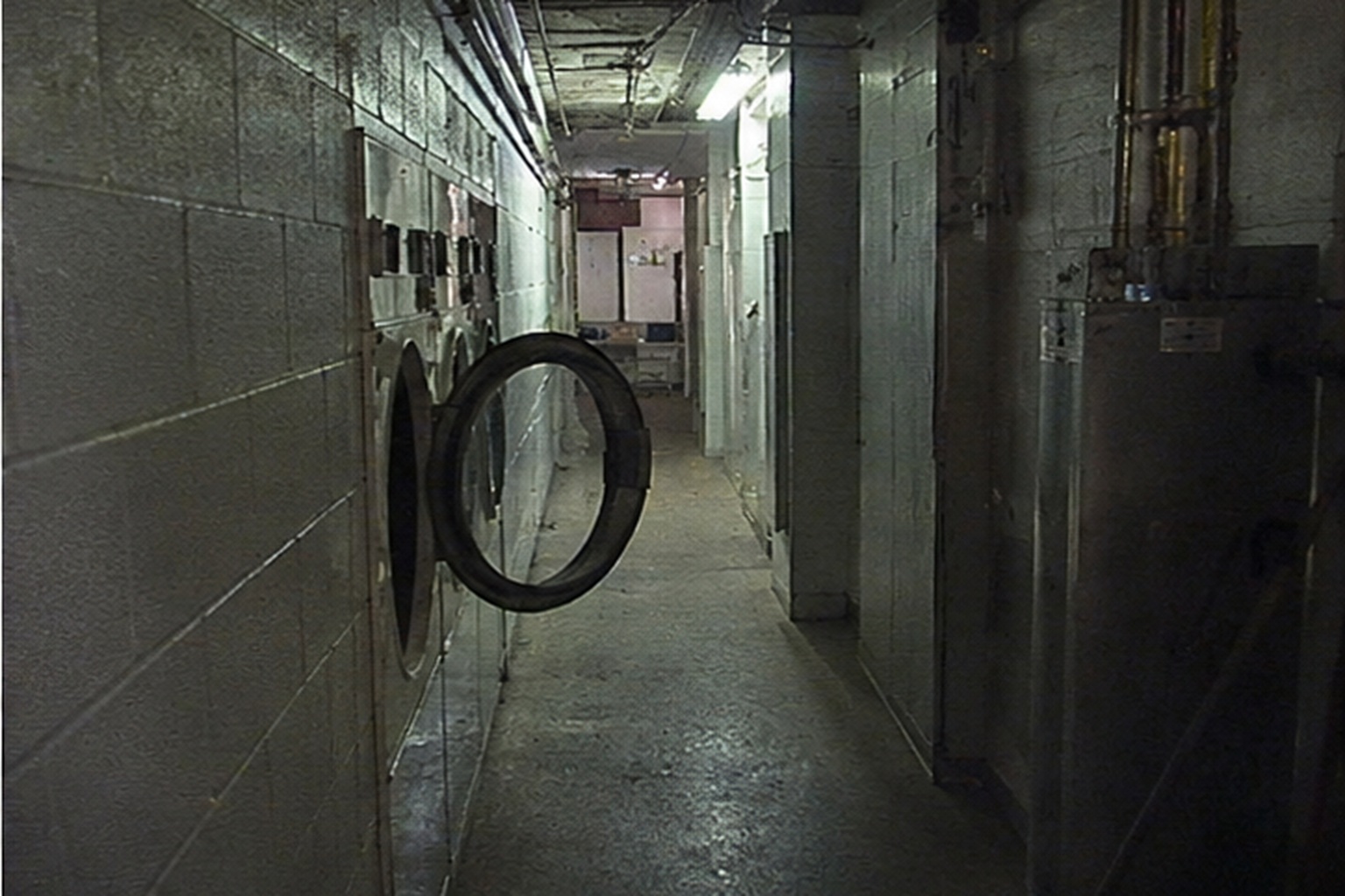 At 3:12 a.m., one dryer door opened into the service hall like someone had pushed it from the dark.