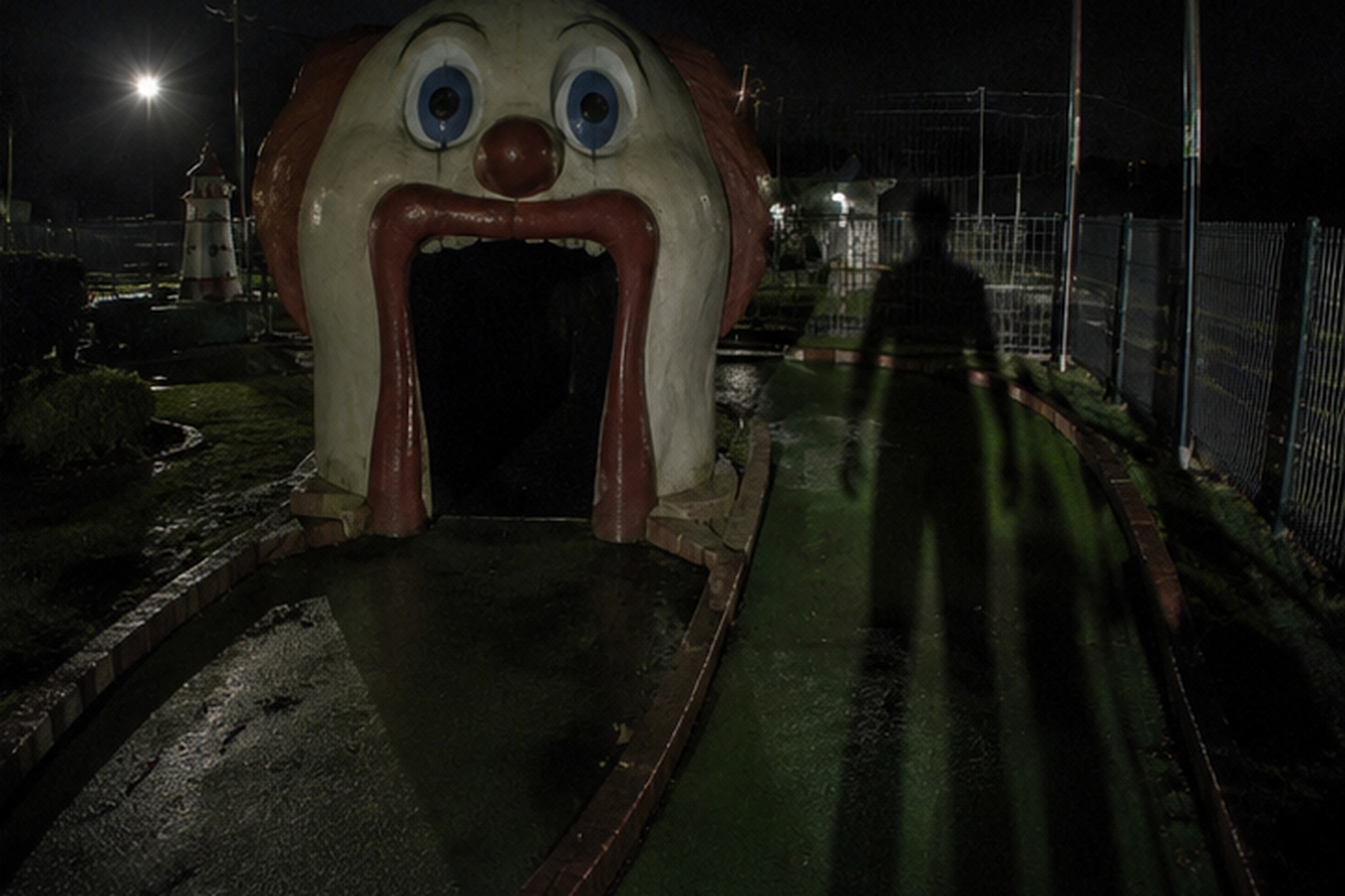 The part people argued about was the shadow standing beside the clown mouth after the ball stopped.