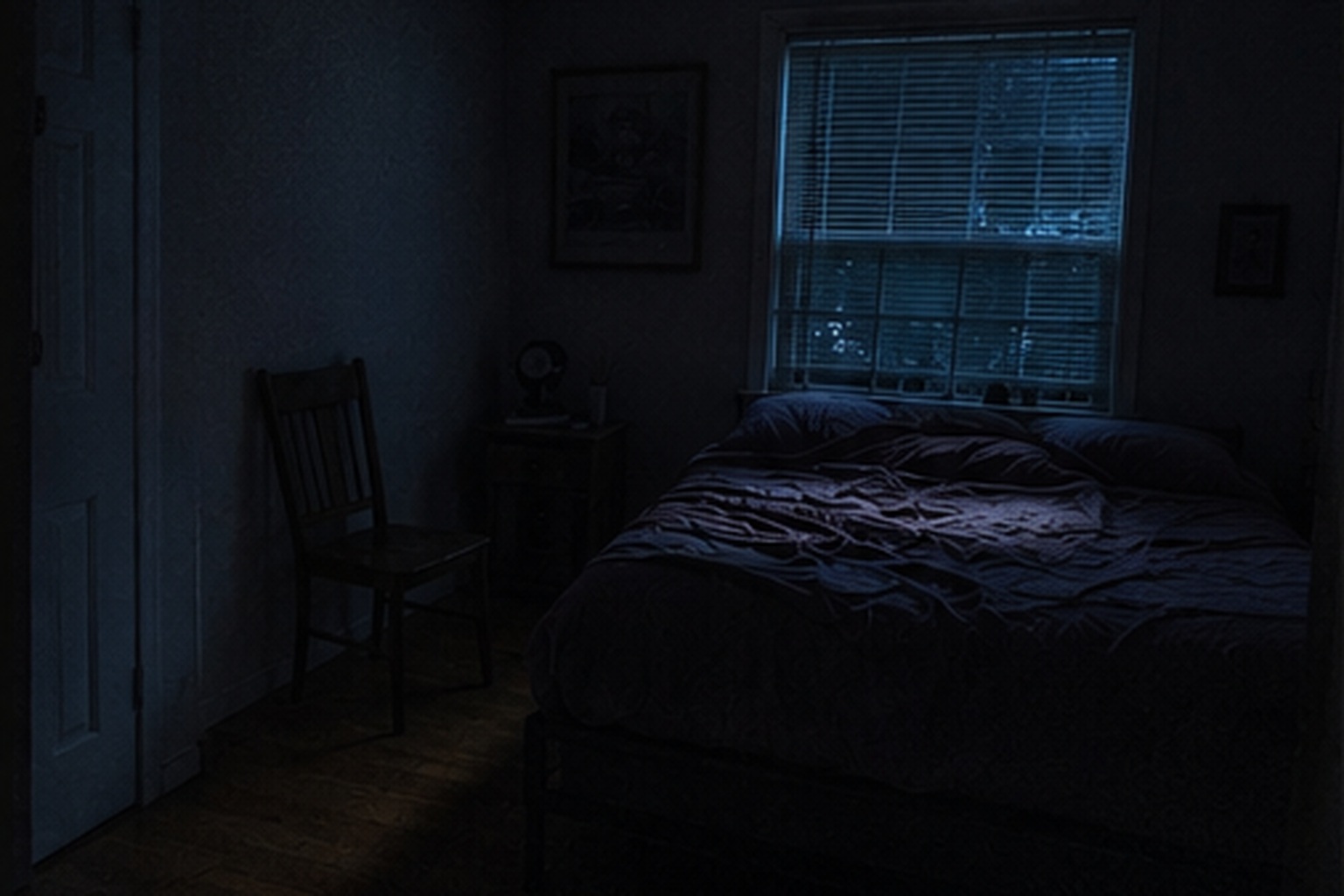 Old chair beside a bed at night