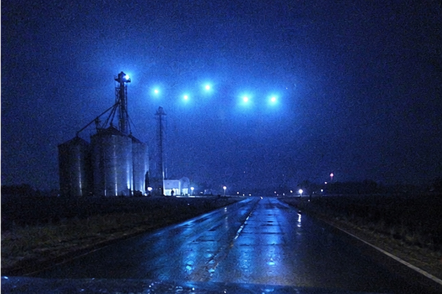Over Silo Road, the lights held above the grain bins without blinking like aircraft or moving like tower beacons.
