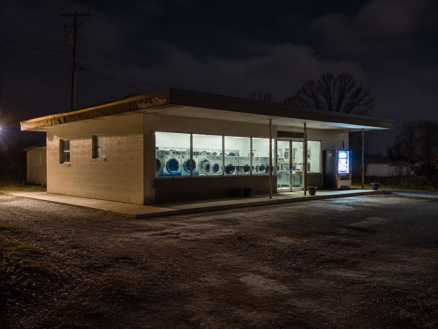 Rural laundromat exterior at night