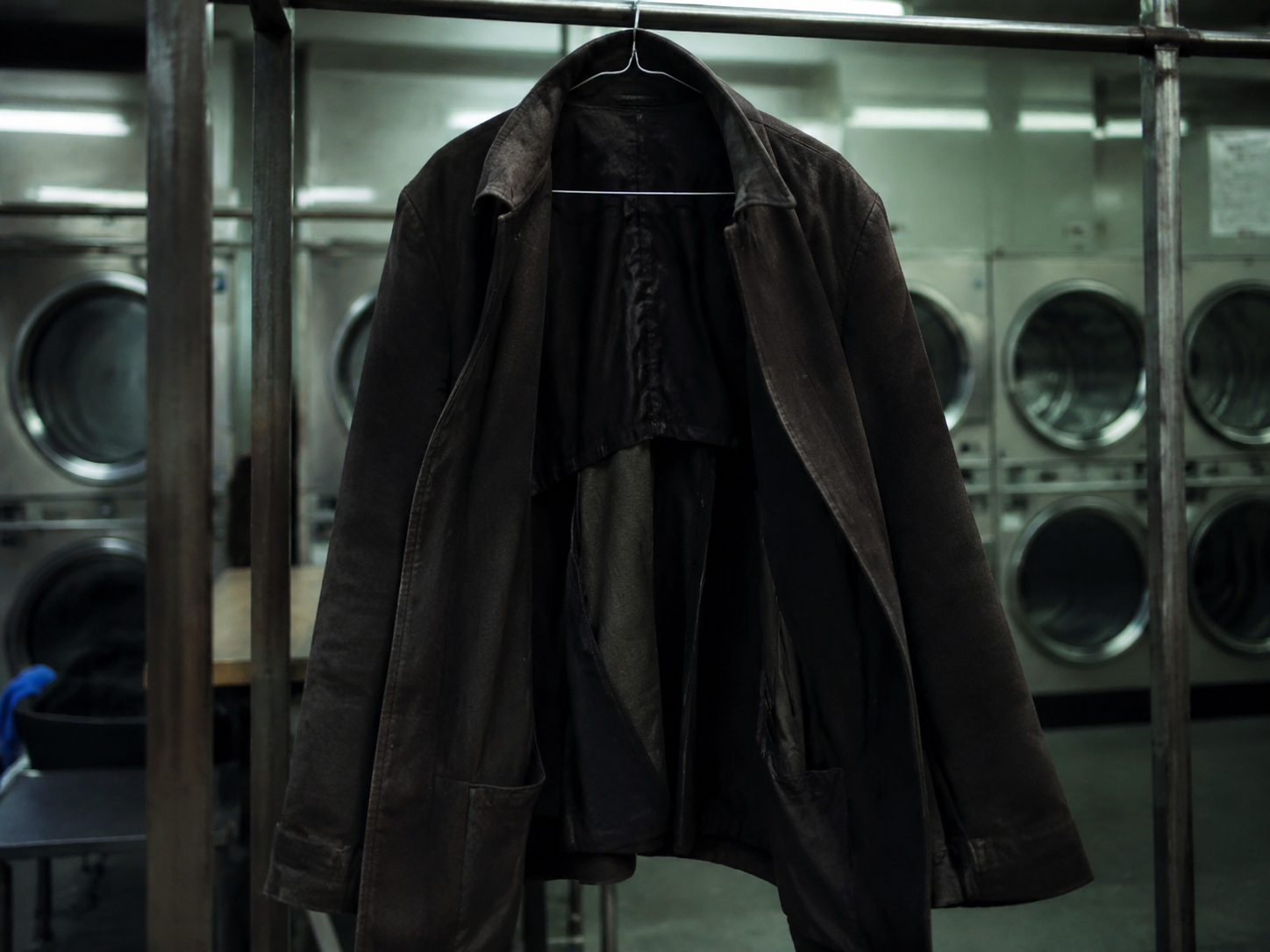 Coat hanging open on lost-and-found rack