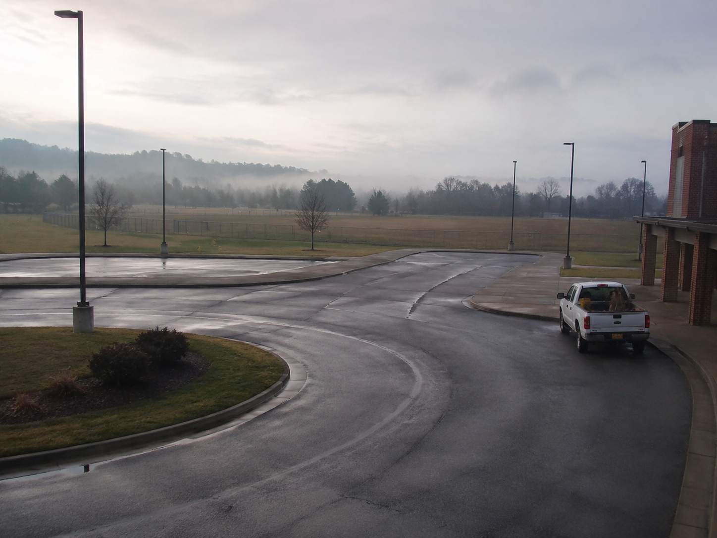 The rural school bus loop sits empty the morning after the lights were recorded.