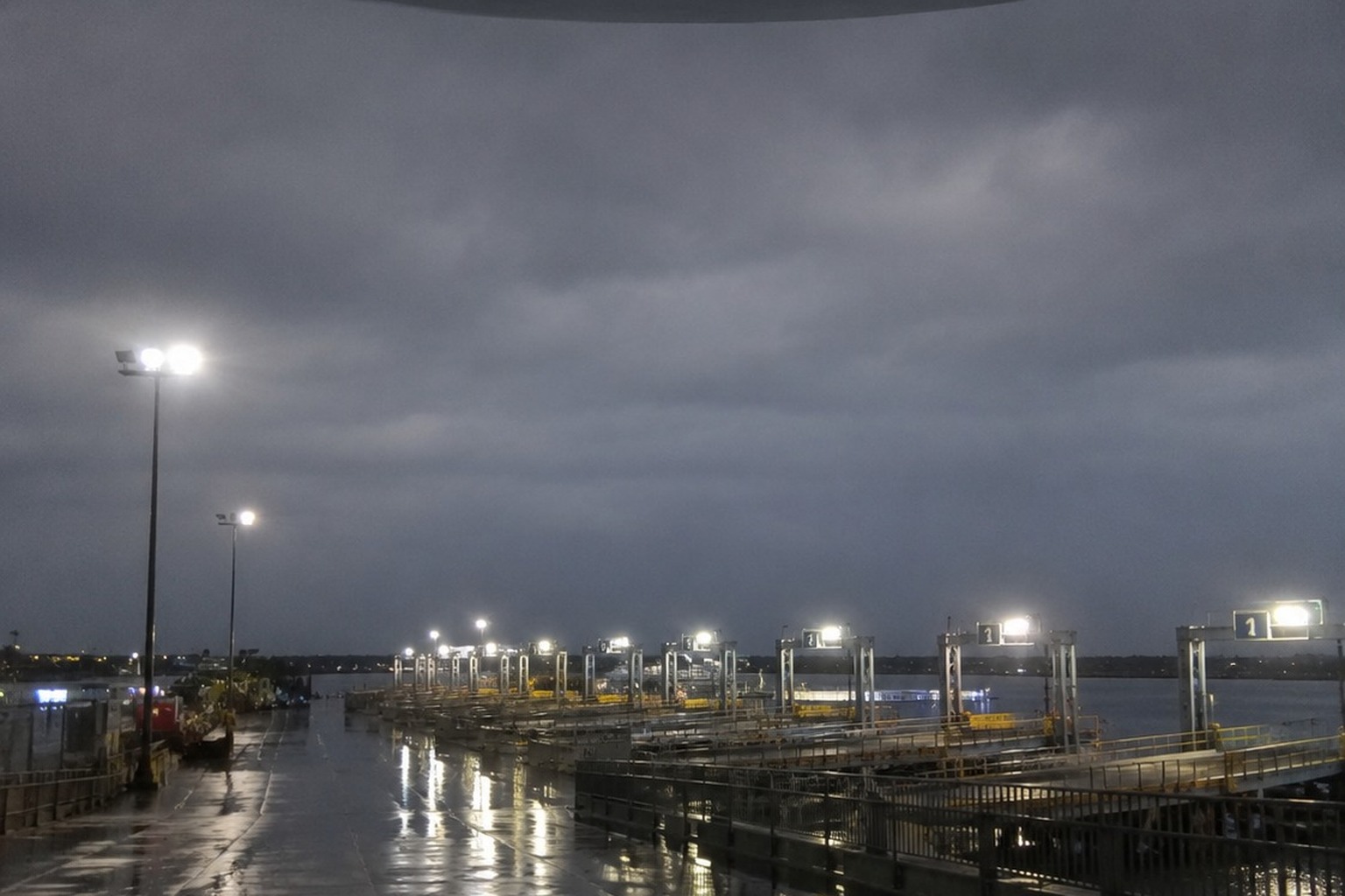 The Empty Ferry Terminal Photo Caught A Dark Oval Craft Above The Ramp Lights reconstructed scene 1
