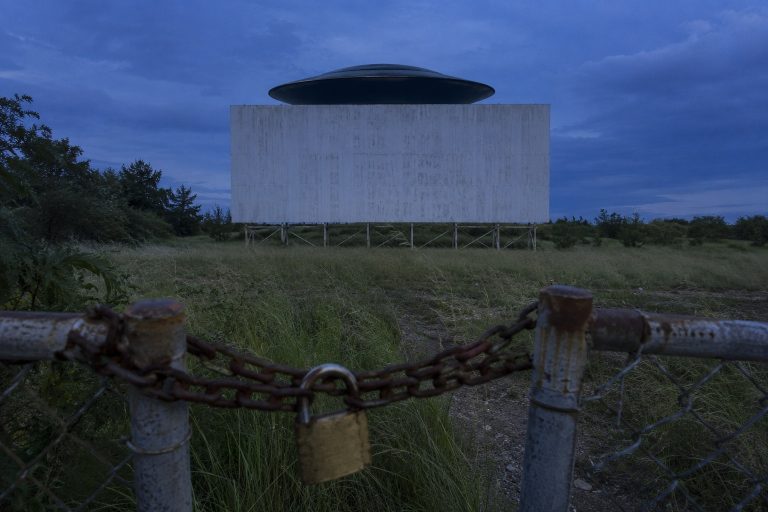 Editorial recreation of the A Black Saucer Hovered Behind Abandoned Drive-In Screen After Closing story, image 1.