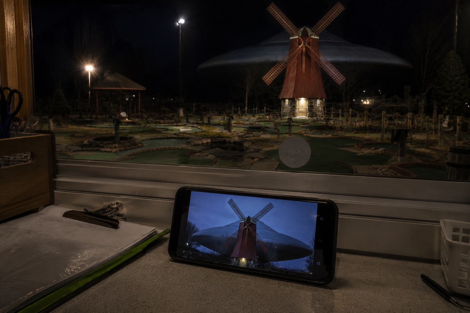 Editorial recreation of the A Dull Saucer Hung Behind Closed Mini Golf Windmill During The Power Flicker story, image 3.