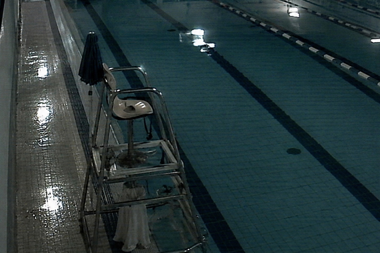 The Closed Indoor Pool Camera Showed A White Dress Under The Lifeguard Chair - article image 2