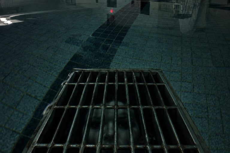 The Closed Indoor Pool Drain Camera Recorded A Pale Face Under The Grate