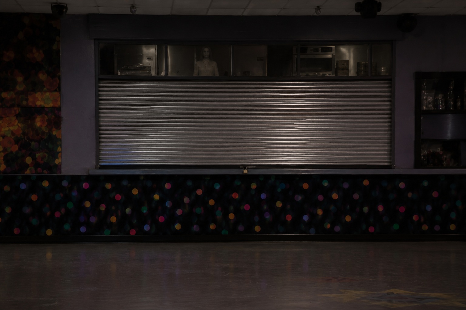 Editorial recreation of the Closed Roller Rink Camera Showed A Girl Skating Past The Dark Snack Bar story, image 4.
