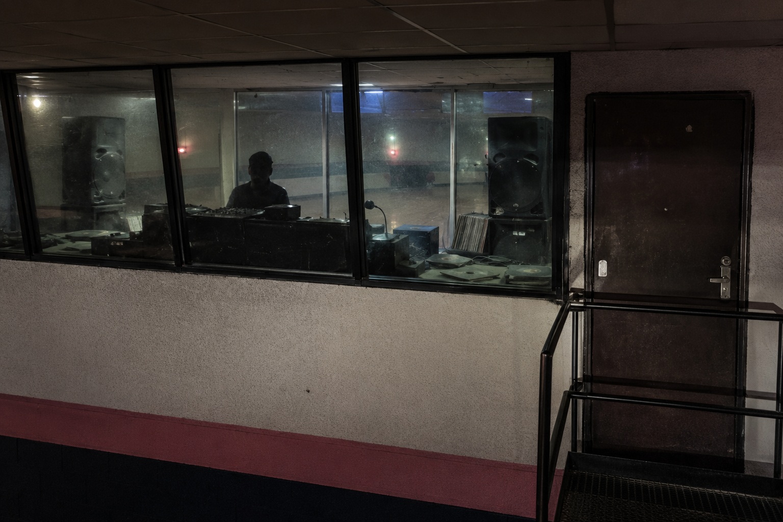 Editorial recreation of the Closed Roller Rink Ceiling Camera Showed A Pale Figure Sitting In The DJ Booth After Lockup story, image 2.