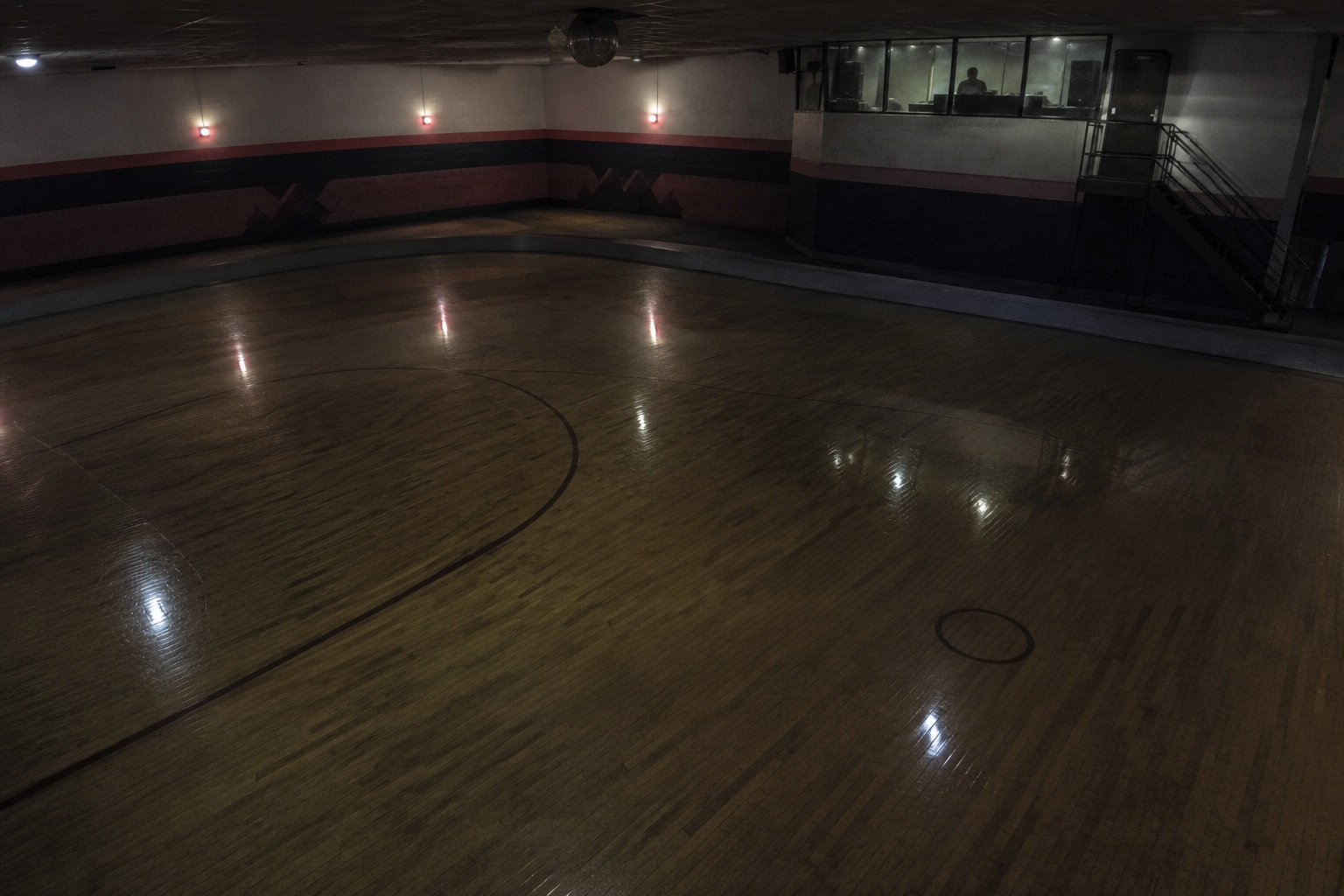 Editorial recreation of the Closed Roller Rink Ceiling Camera Showed A Pale Figure Sitting In The DJ Booth After Lockup story, image 3.