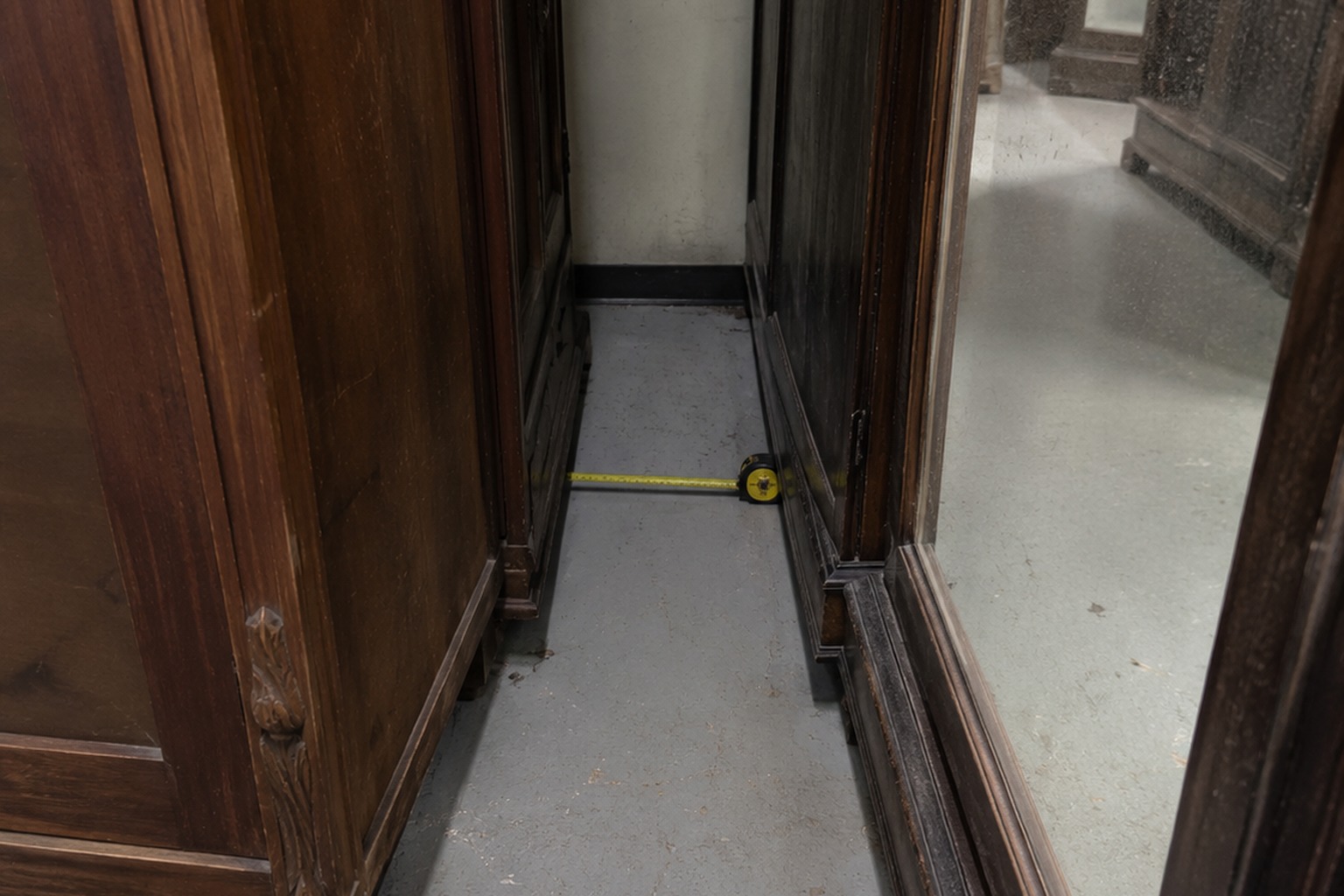 The Closed Thrift Store Mirror Aisle Camera Showed A Hand Reaching From Behind A Covered Wardrobe reconstructed scene image 2