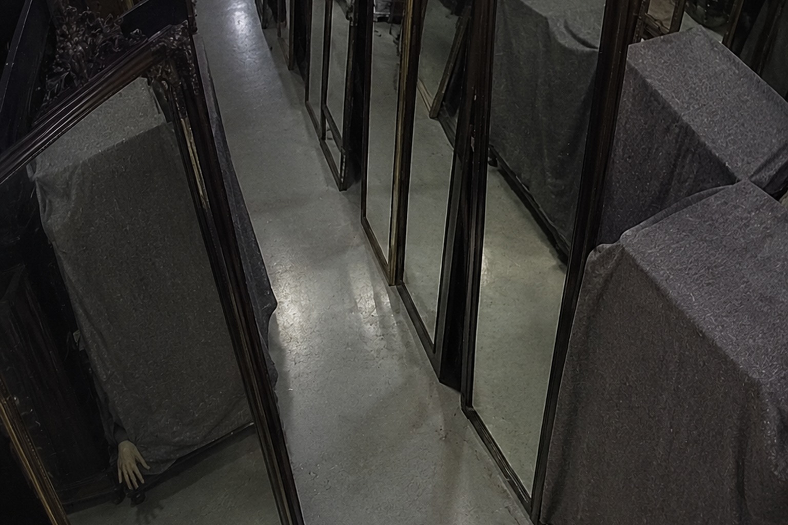 The Closed Thrift Store Mirror Aisle Camera Showed A Hand Reaching From Behind A Covered Wardrobe reconstructed scene image 3