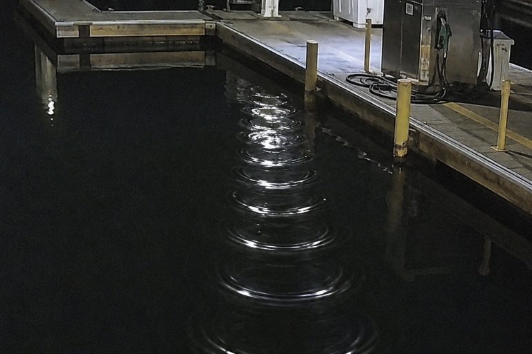 Editorial recreation of the Marina Fuel Dock Camera Showed Ripples Around Legs No One Could See story, image 1.