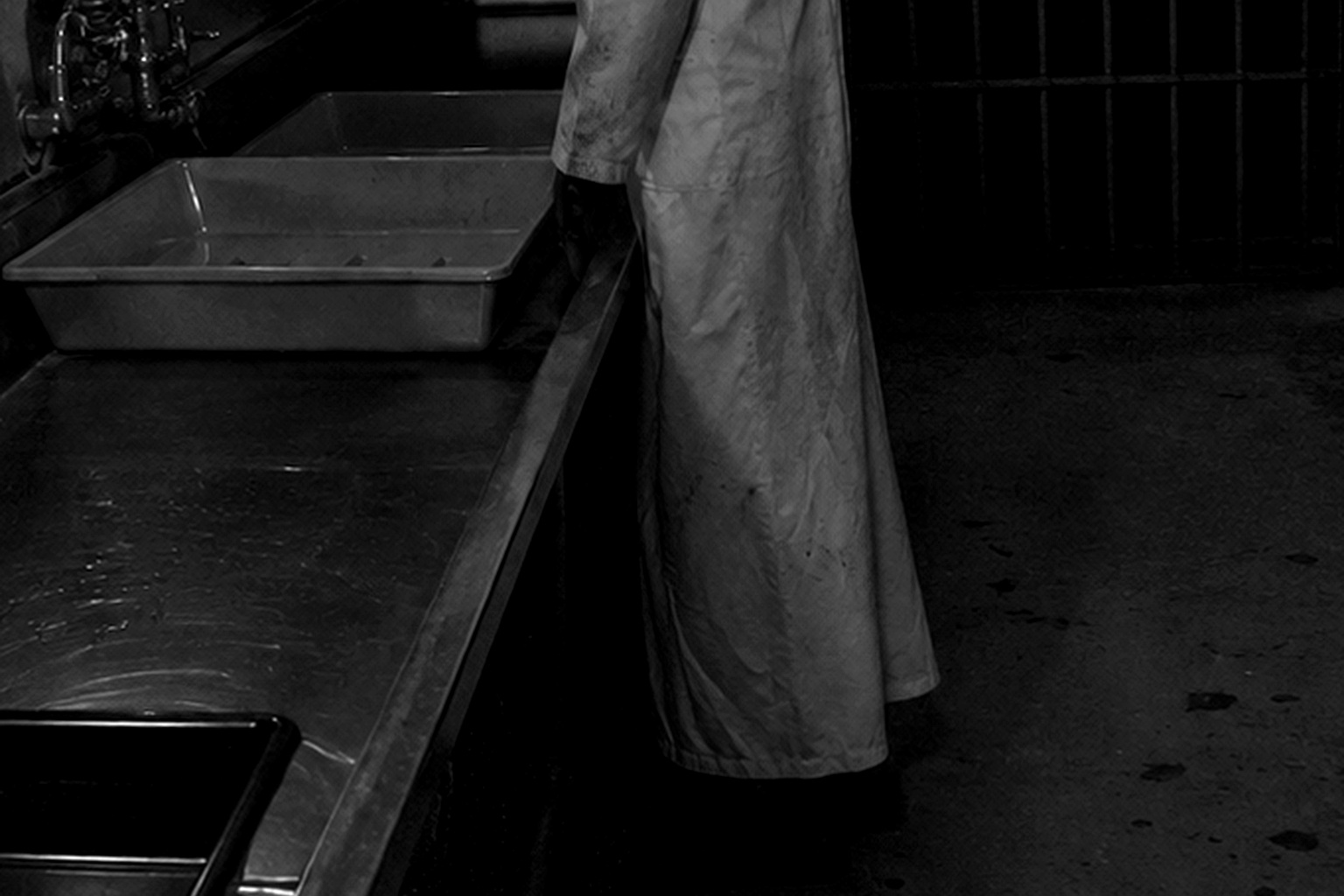 Editorial recreation of the Old Photo Lab Darkroom Camera Showed A White Apron Figure Standing Beside The Developing Sink story, image 3.