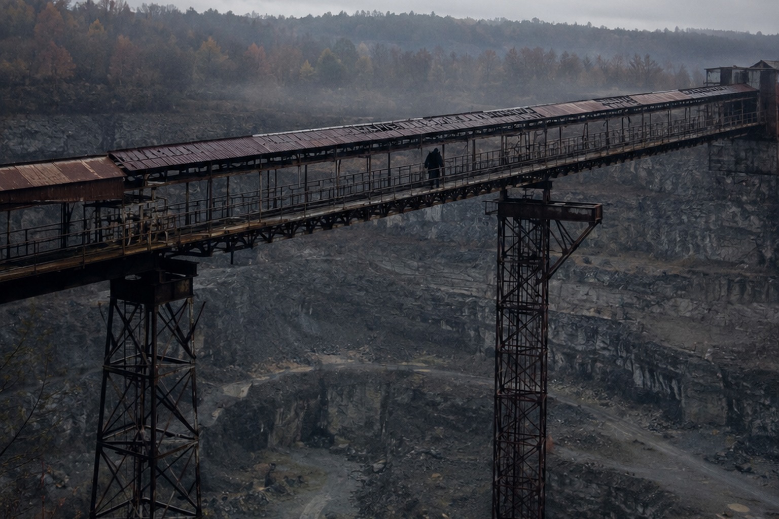 Editorial recreation of the Old Quarry Conveyor Photo Showed A Broad Hairy Figure Crossing The Rusted Catwalk story, image 1.