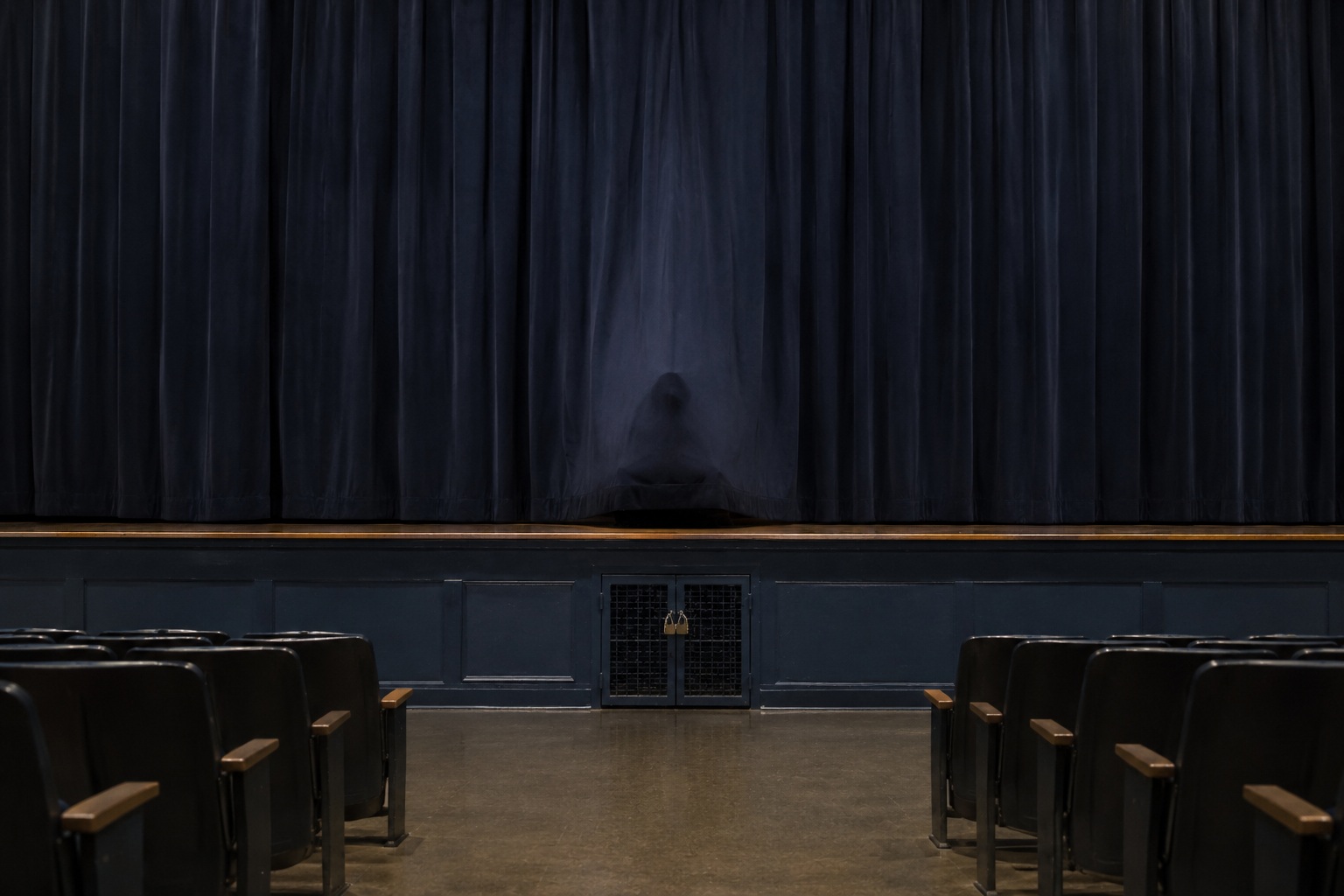 Editorial recreation of the School Auditorium Was Empty But Someone Was Sitting Under The Stage Curtain story, image 2.